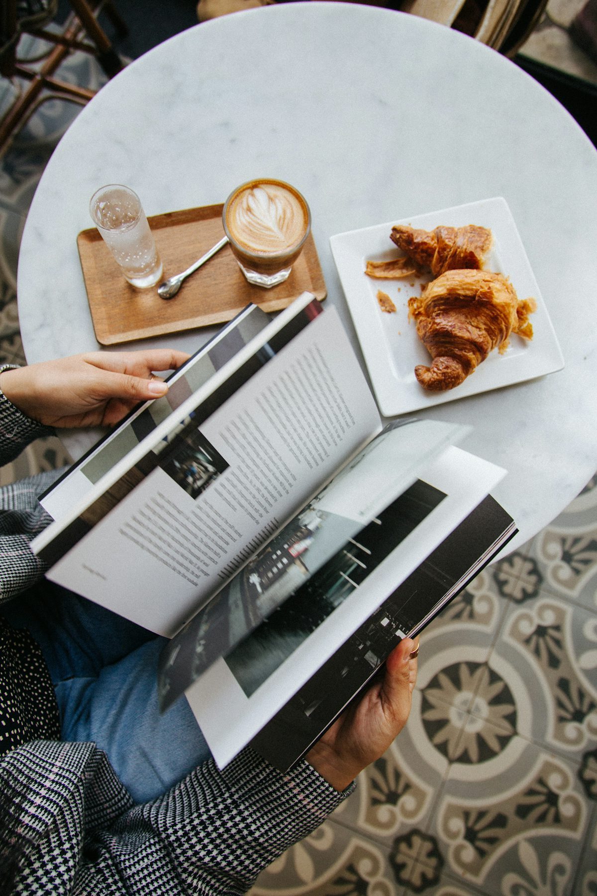 An overhead view of a French breakfast — pastries on a delicate ceramic plate
