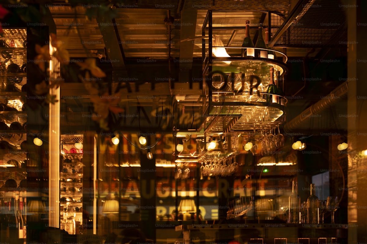 The warm interior of a Parisian cocktail bar at night
